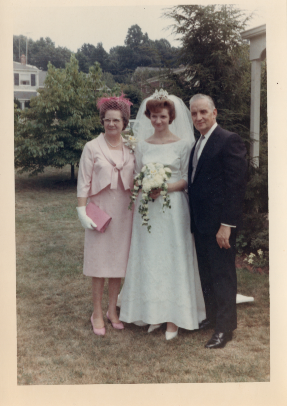 Bride poses with woman and Pastor Roberson