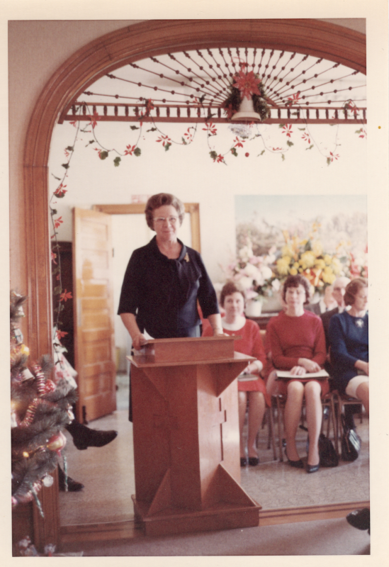 Woman speaks at a podium