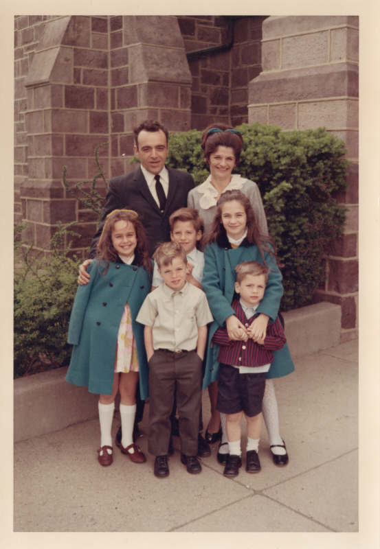 A man and woman with three boys and two girls outside of the building at 18th and Spring Garden streets