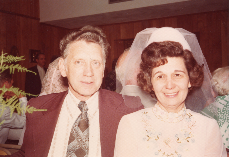 A bride poses with a man