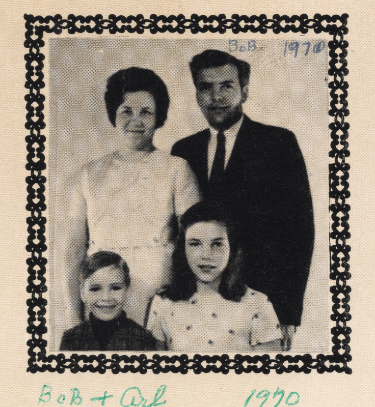 A man, women, boy and girl pose for a portrait. Their photograph is labeled "Bob + Arl"