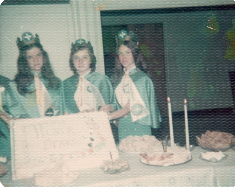 Three missionettes pose with a cake reading "Honor Stars"