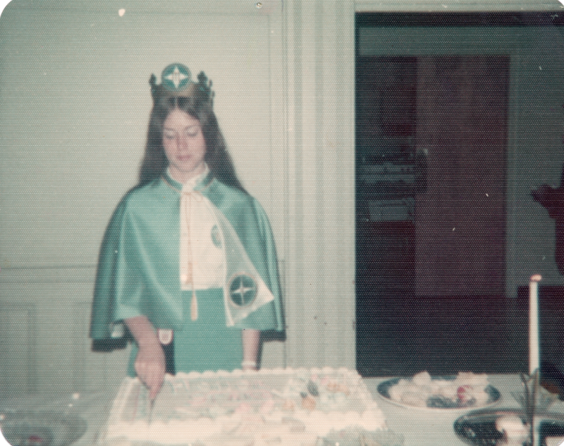 A missionette cuts a cake