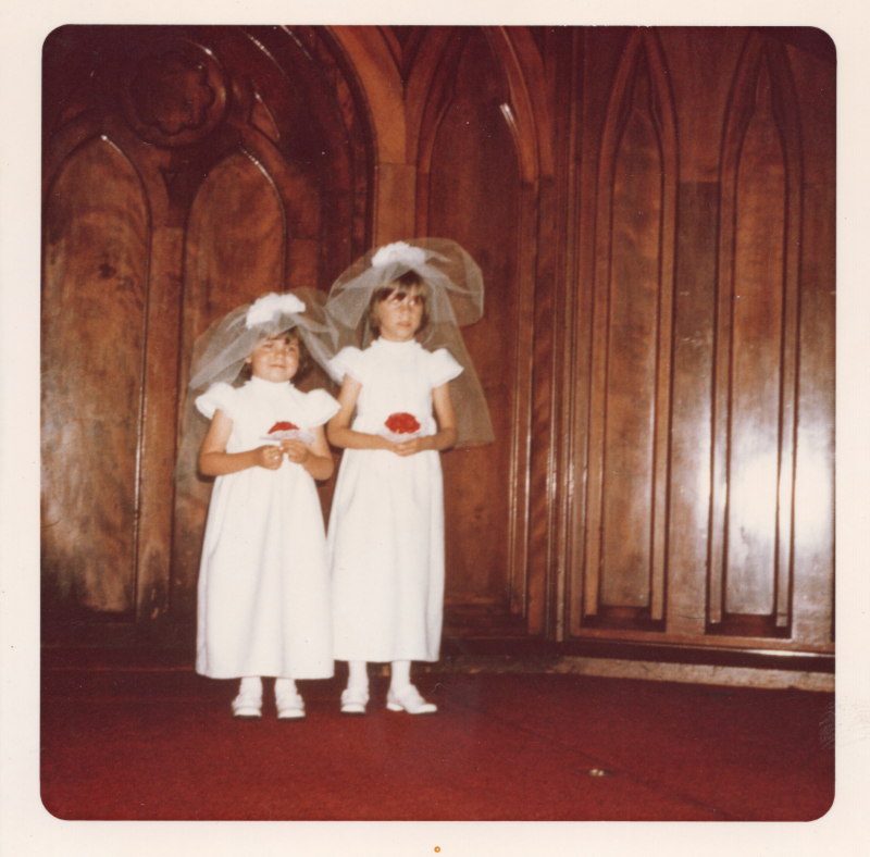 Two young girls on the sanctuary stage in wedding gowns