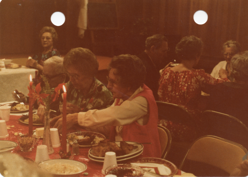 Two older women dine together