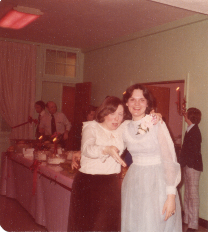Two women pose together for a photograph