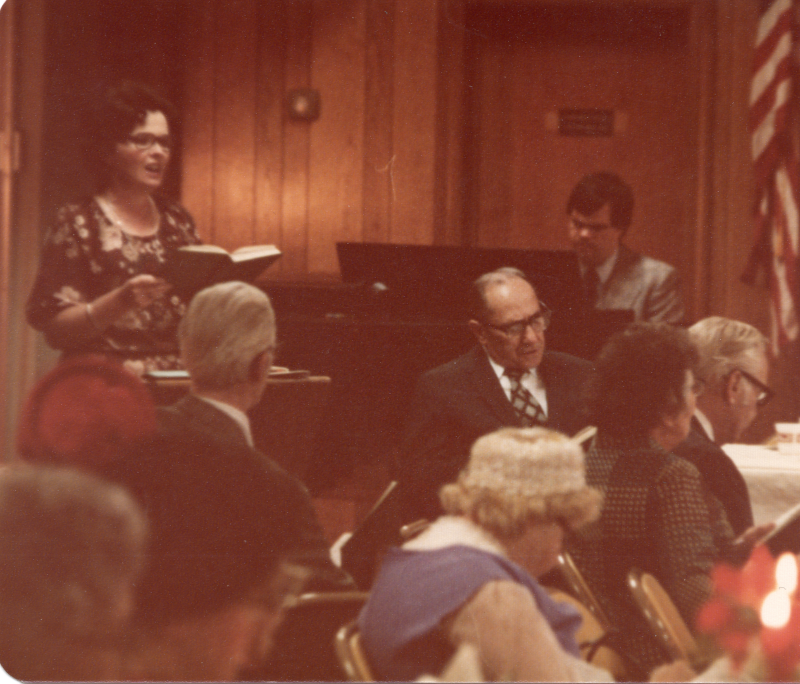 Mrs. Stone leads a hymn