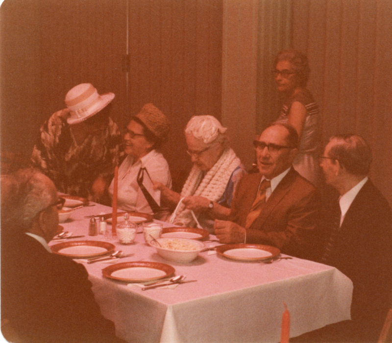 A group dines around a table