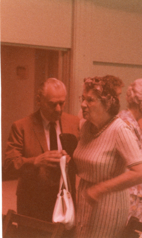 A man and a woman rise from their seats