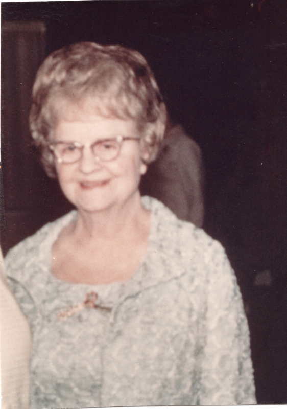 An older woman smiles for a portrait