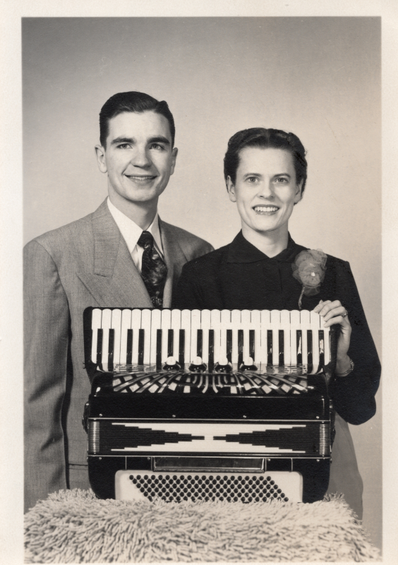 Robert and Lillian Roberts smile with an accordion