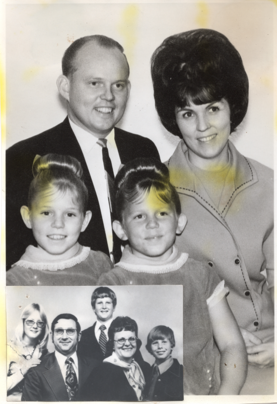 A man and woman smile with their two daughters