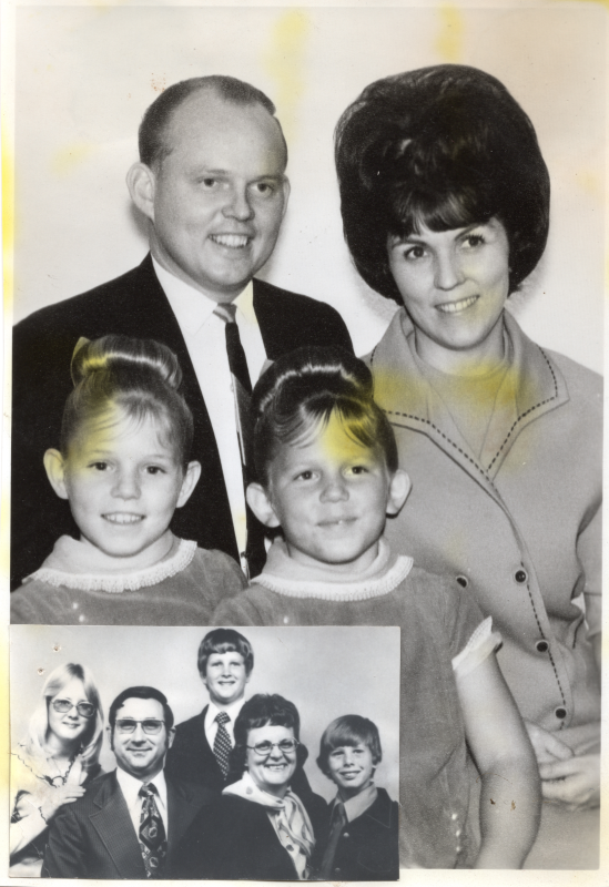 A man and a woman smile with their daughter and two sons