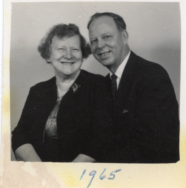 A man and woman smile for a photograph