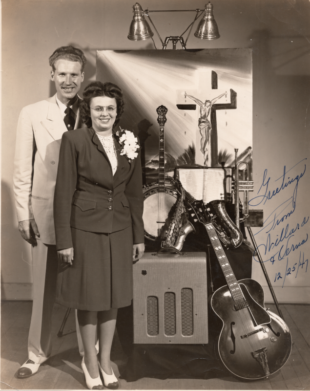 Evangelists Willard and Verna Cantelon send greetings from a signed portrait of themselves with musical instruments, a Bible, and a picture of Jesus on a cross