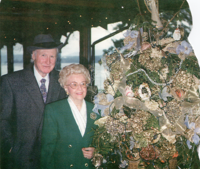 Willard and Verna Cantelon smile with a Christmas tree