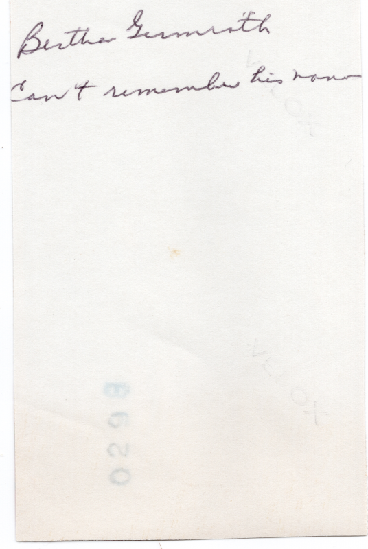 Provides the family name of the couple in the photo (illegible)