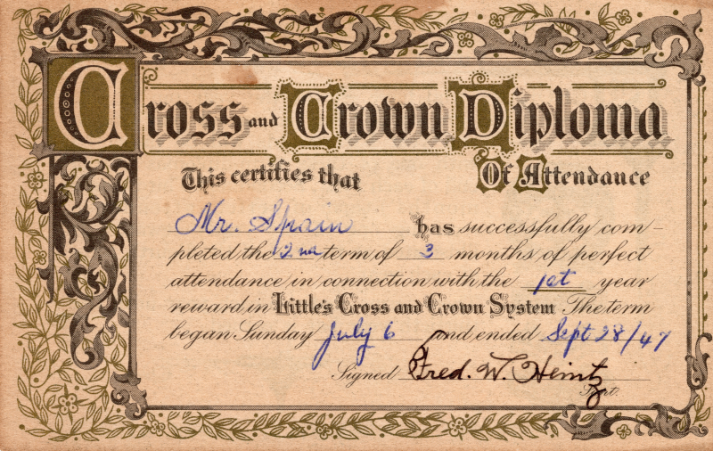 Recognizes perfect attendance by Ms. Spain in the second three months of the first year of the Cross and Crown System, signed by Fred W. Heinz