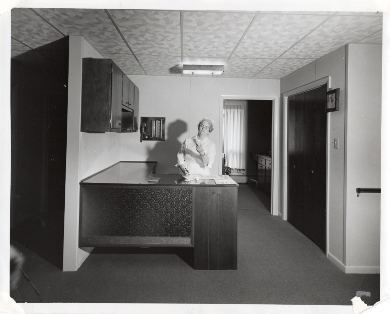 Nurse doses medications at the Highway Home for the Aged