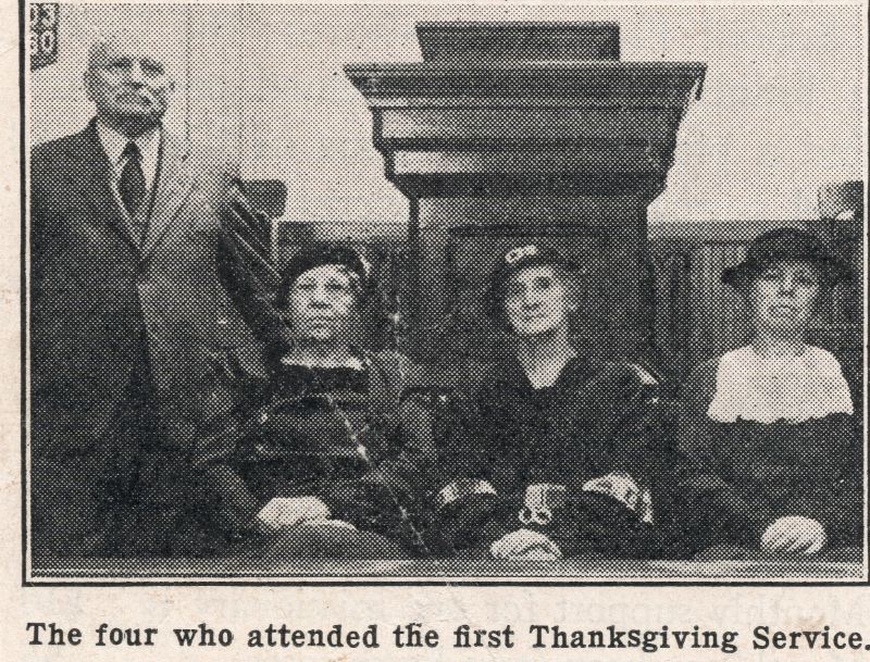 A man poses with two women with the caption, "The four who attended the first Thanksgiving Service."
