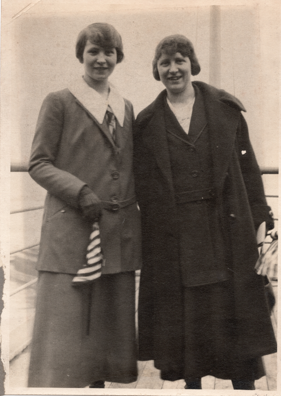 Two women smile together for a portrait