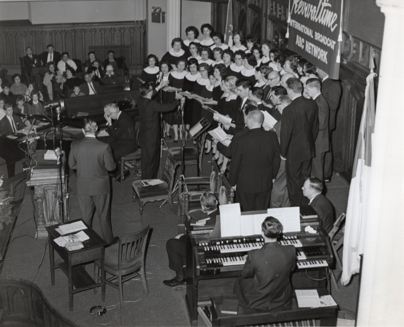 The Highway Choral Group performs with an organist for the Revivaltime radio broadcast in the sanctuary at 18th and Spring Garden Sts. in front of a congregation