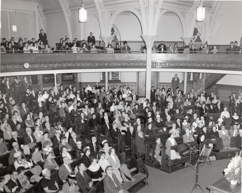 A packed congregation watches the live radio broadcast of Revivaltime