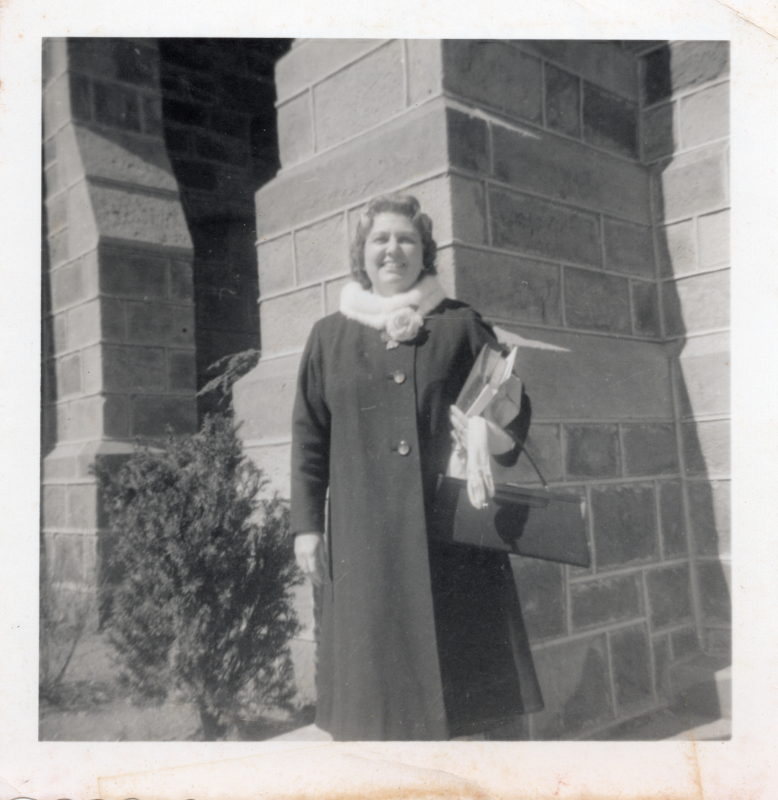Hildegarde smiles for a portrait outside of Highway Tabernacle (18th and Spring Garden)