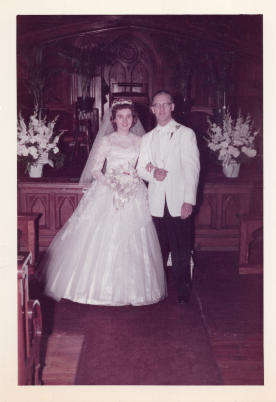 A bride and groom smile together in the sanctuary at 18th and Spring Garden Streets