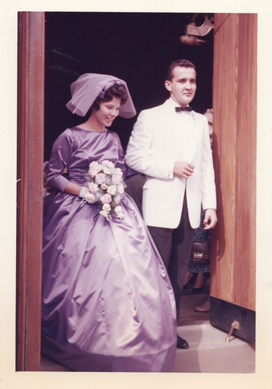 A bridesmaid and groomsman exit the church at 18th and Spring Garden together, likely the wedding of id_1104