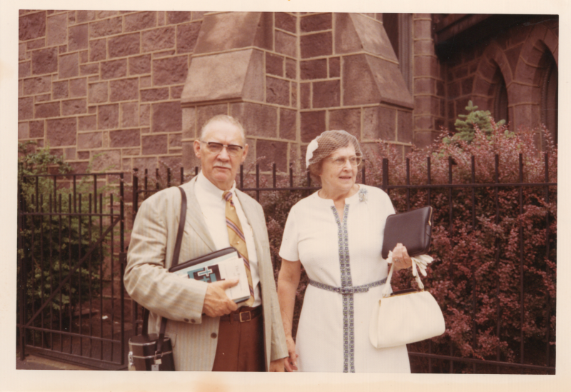 A man and woman are photographed outside of the church at 18th and Spring Garden