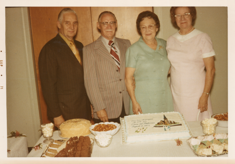 Pastor and Mrs. Roberson smile with Elmer and Madeline at a meal to send them off