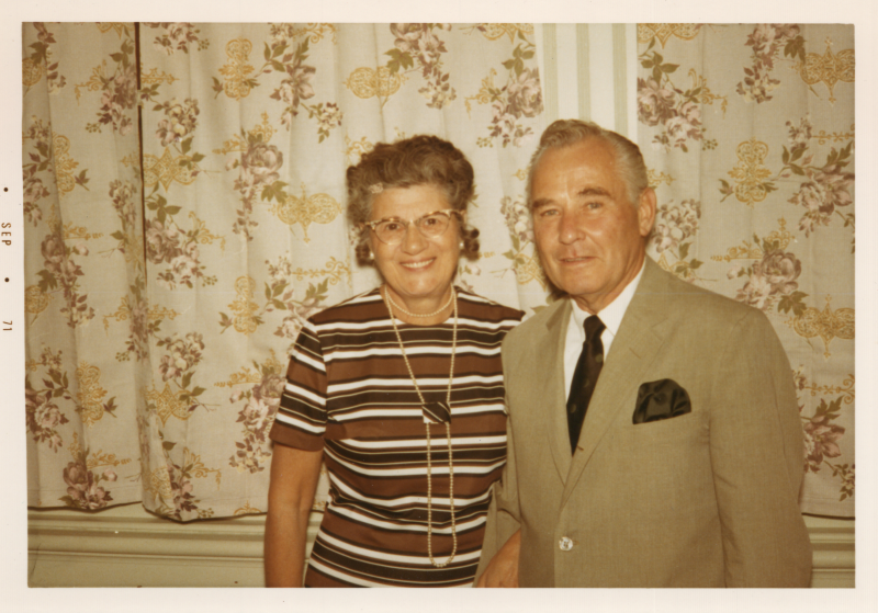A man and woman smile together for a portrait