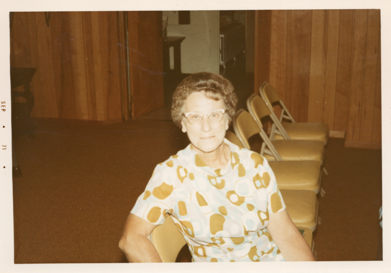 A woman smiles for a portrait