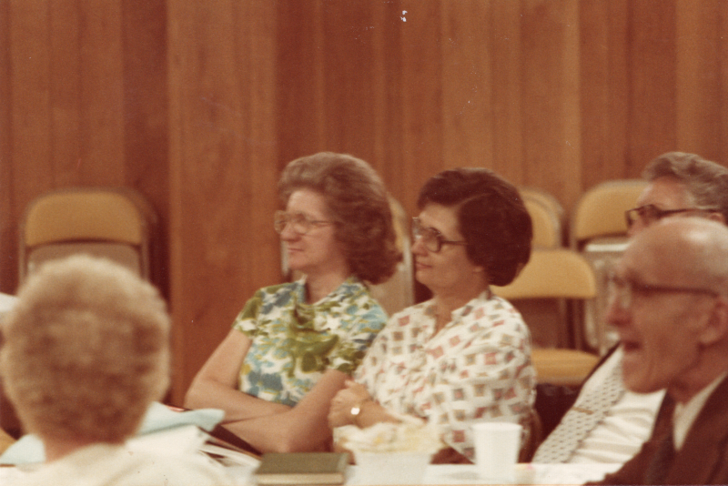 Congregants, including Betty Roberson, dine together