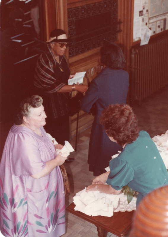 Women speak to each other before walking into the sanctuary