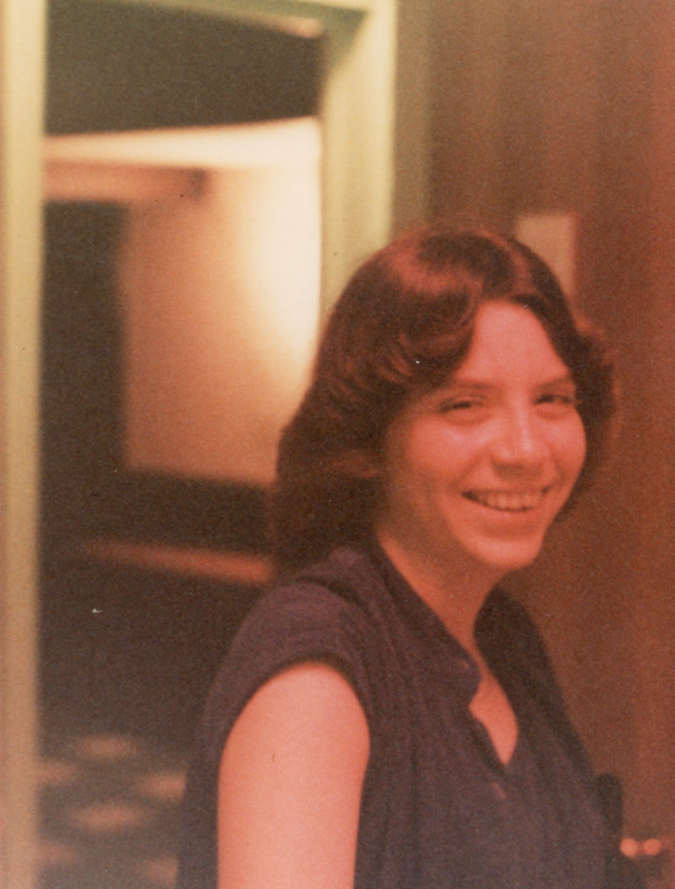 A woman smiles for a portrait image