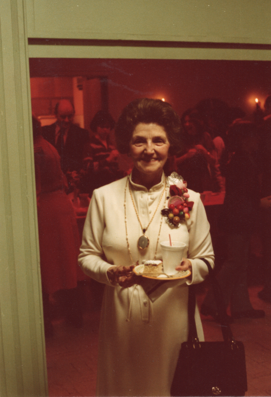 An older woman smiles for a portrait