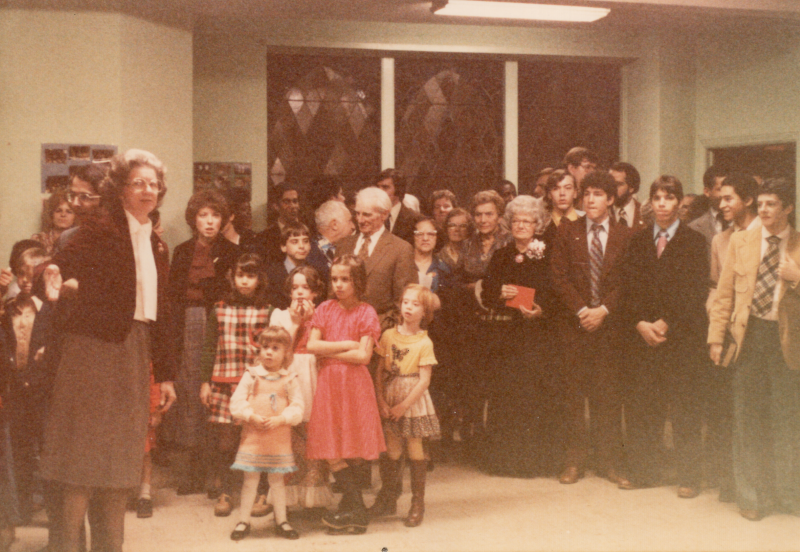 Members of the church pose together for a photograph