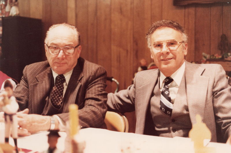 Pastor Bogdan and another man pose for a portrait