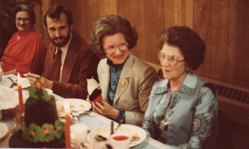 Portrait of Marnie Irocine, Jerry, Betty Roberson, and Ruth Muir dining together at Highway's Thanksgiving fellowship