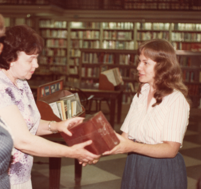 A woman leads VBS with a large-print Bible at the Free Library of Philadelphia Central Branch