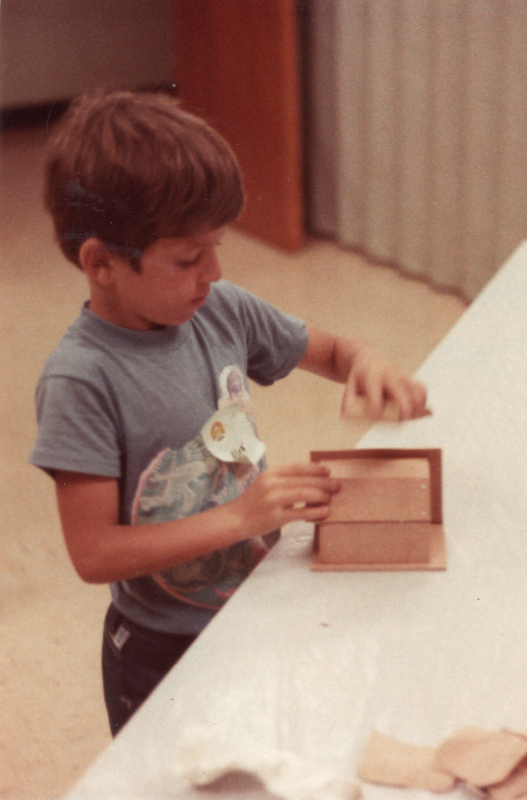 A boy works on a craft