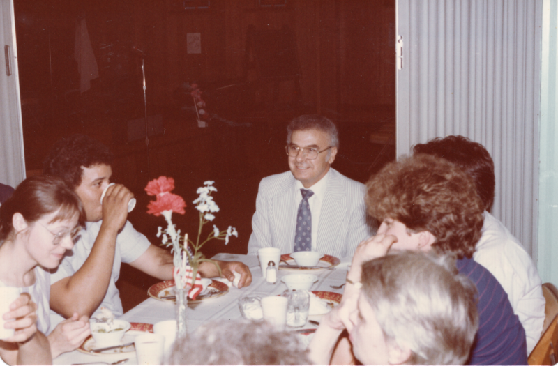 International Fellowship second anniversary meal, Pastor Bogdan dines with a group of congregants