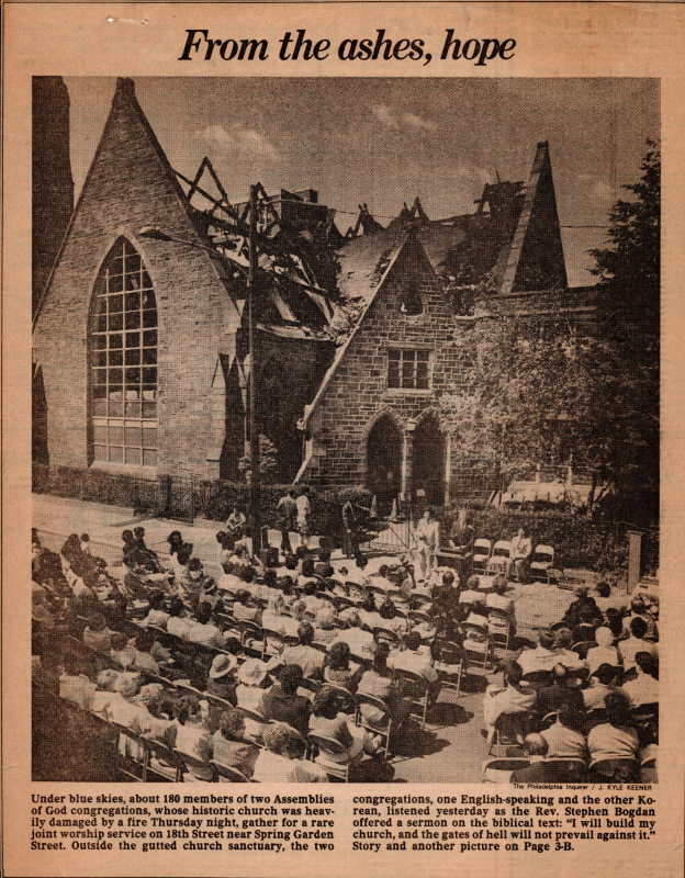 Article and image of the congregation worshipping outside after the fire