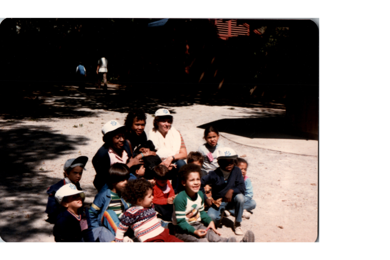 A group poses together for a portrait at the zoo