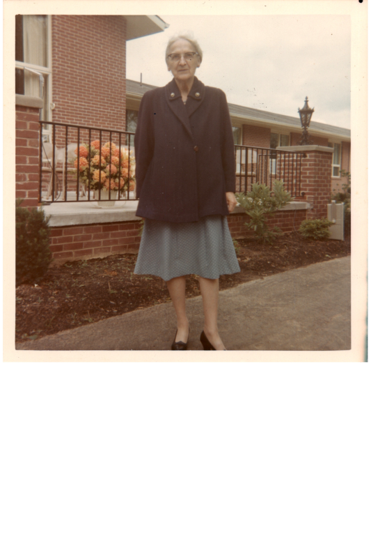 A woman poses for a portrait