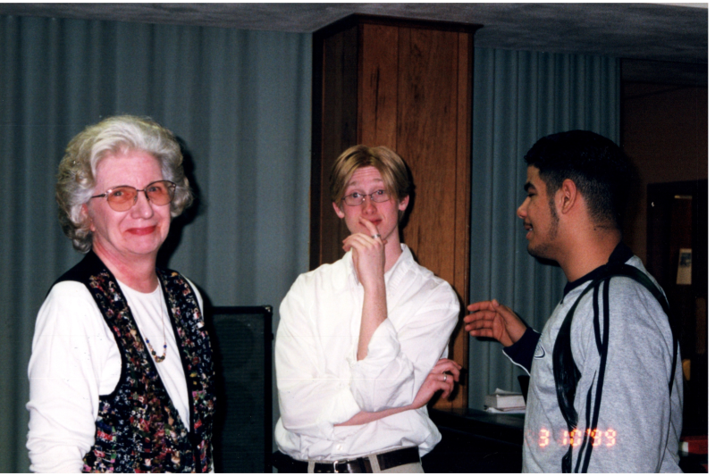 Miss Betty Roberson speaks with two men