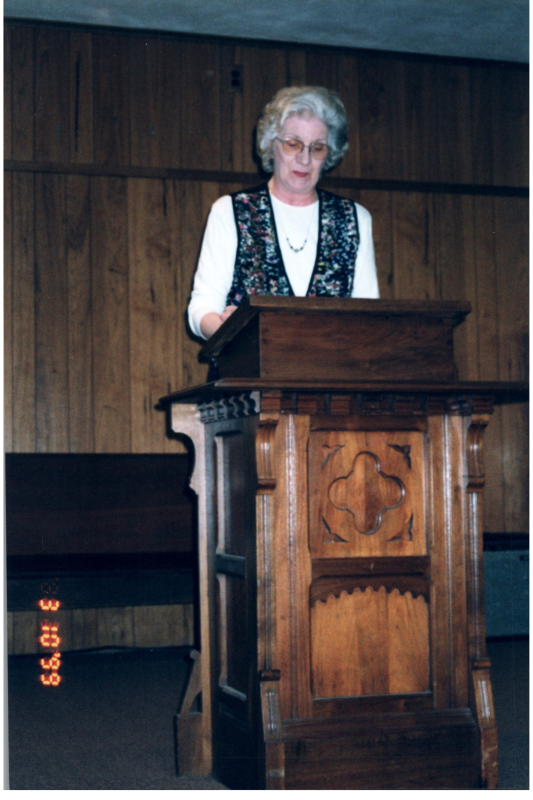 Betty Roberson speaks at a podium