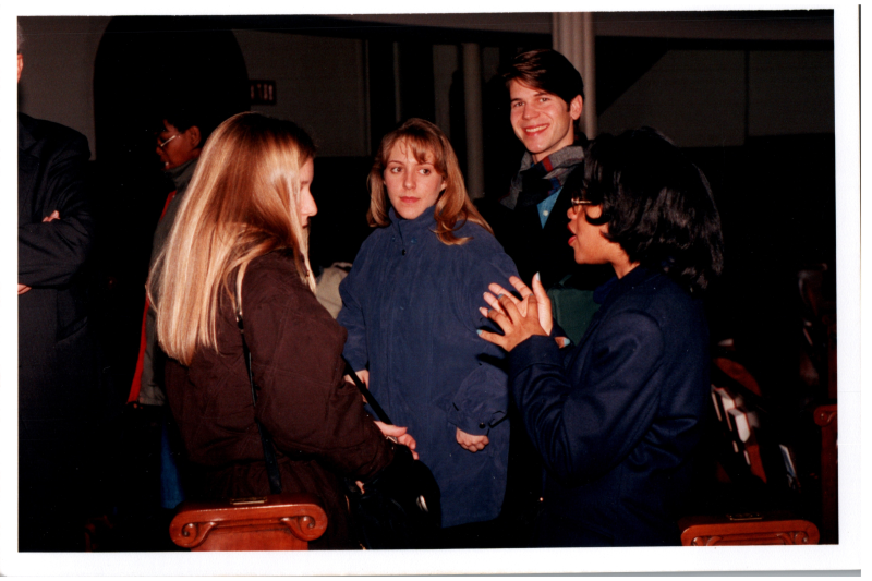 A group talks in the sanctuary